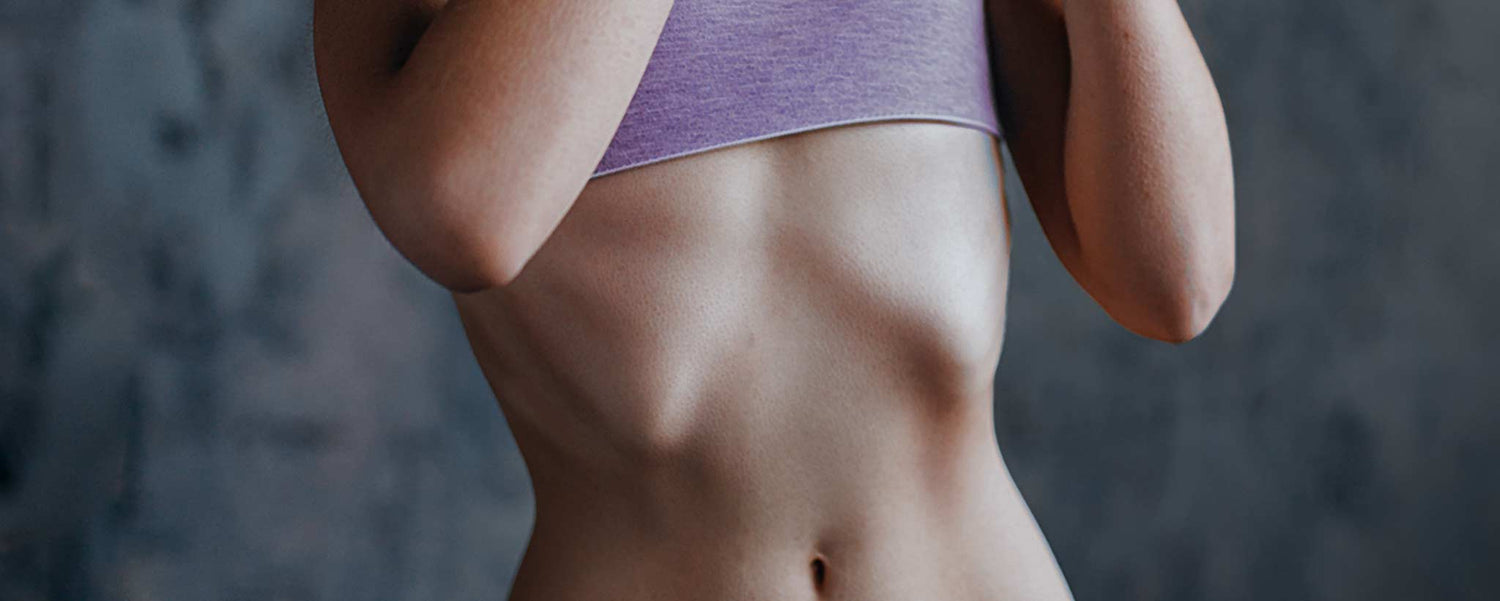 Anorexic female wears lavender underwear.