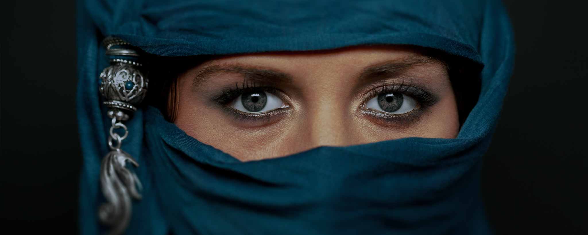 'Woman wearing green Niqab'