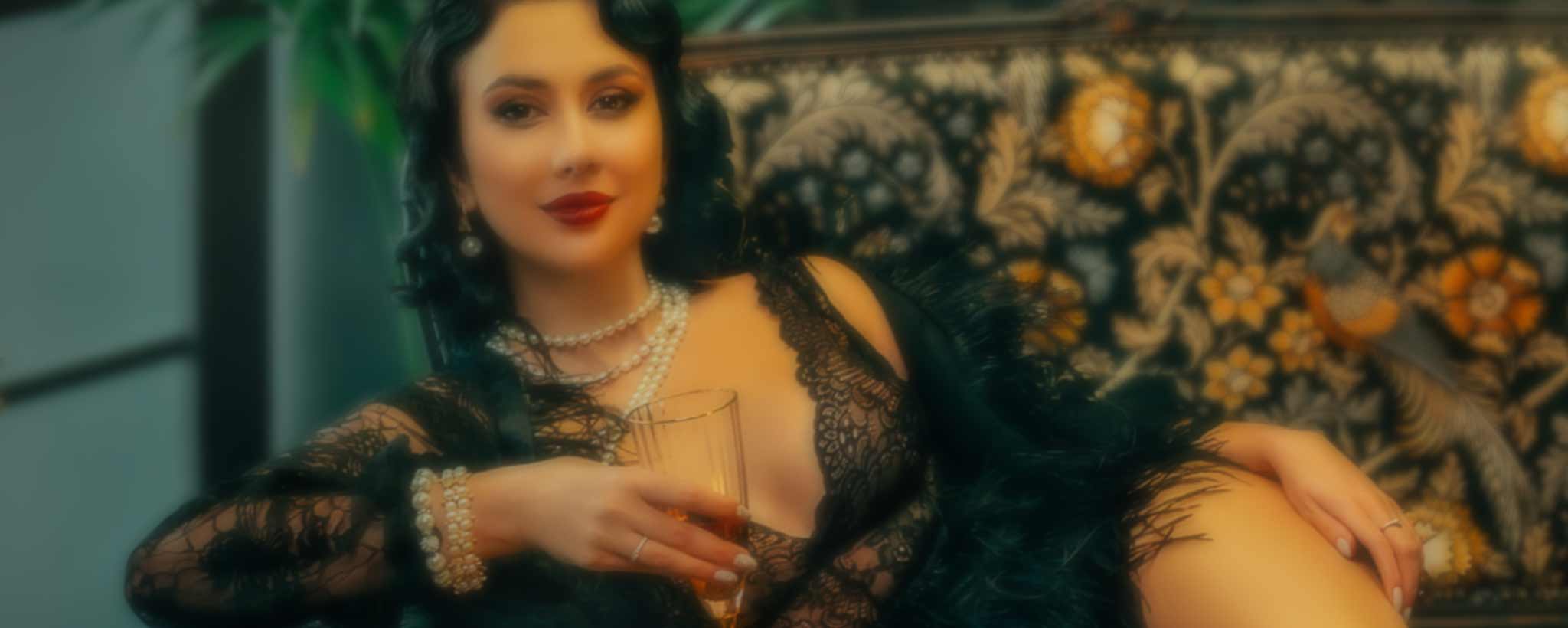 'A beauty model reclining on a sofa.'