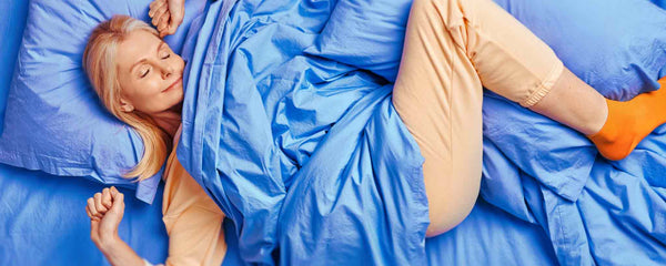 Bed stretching woman