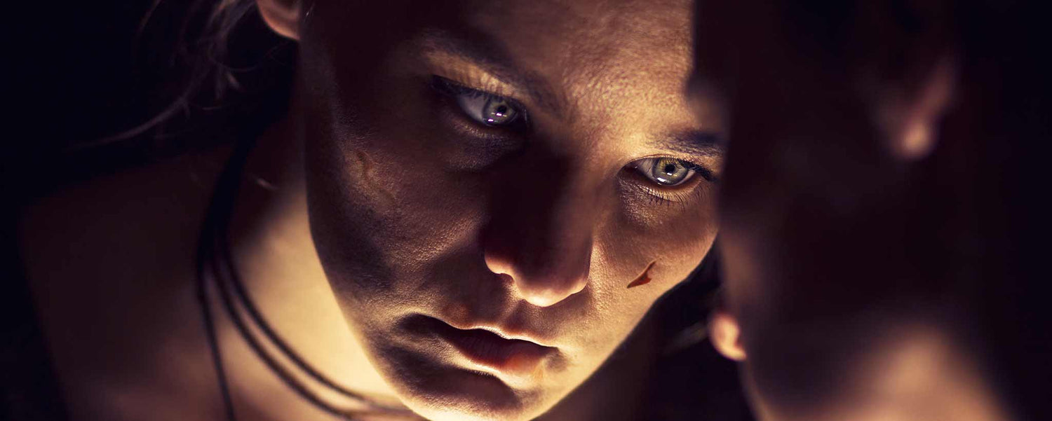 Bruised female mirror reflection