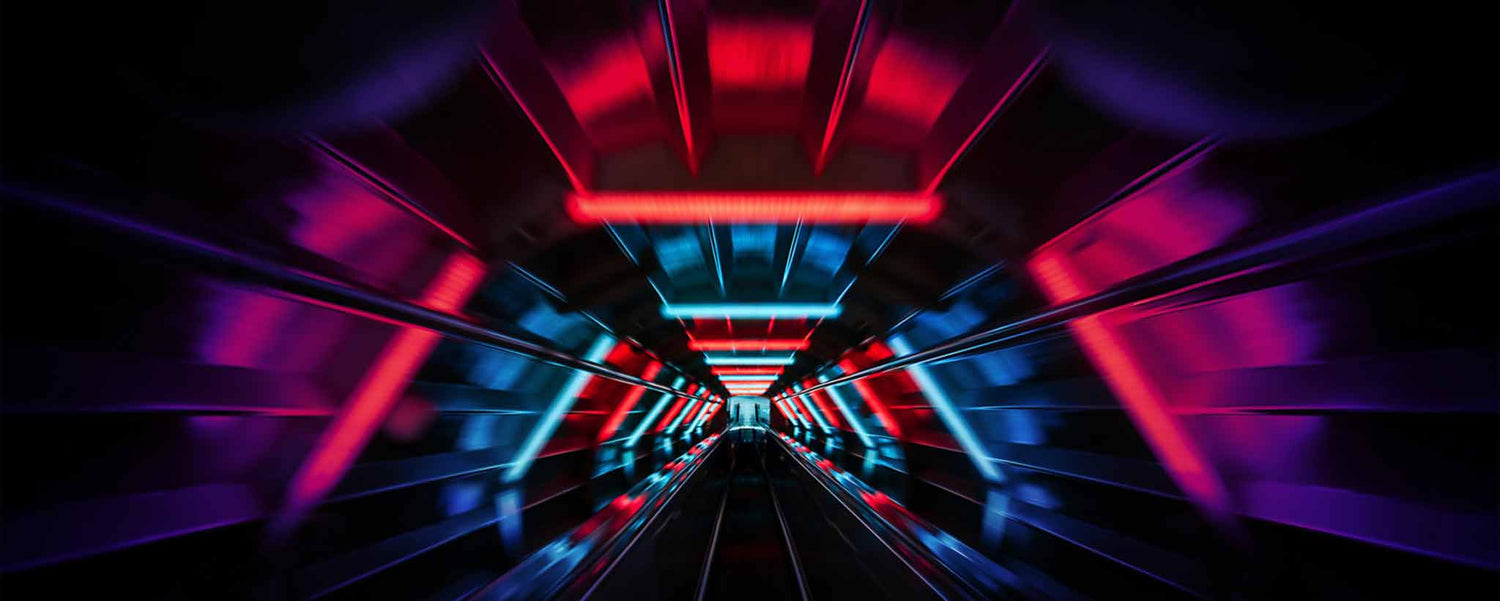 A colorfully lit tunnel.