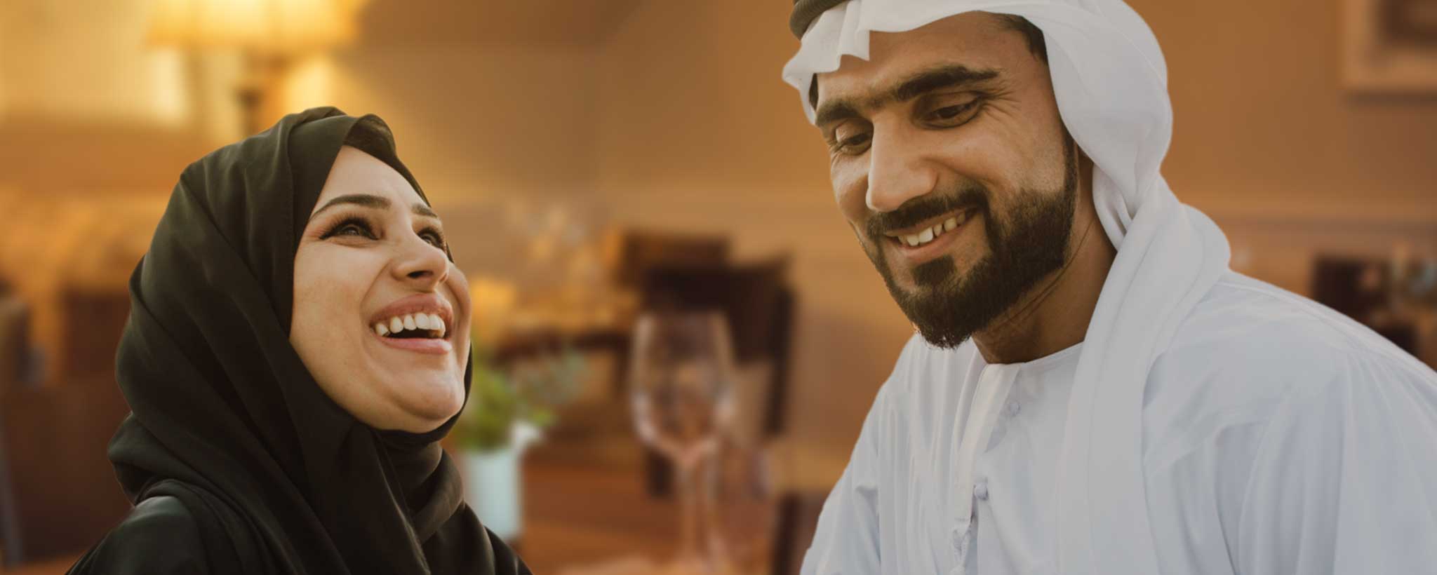 'Burka woman with sheik in a restaurant.'