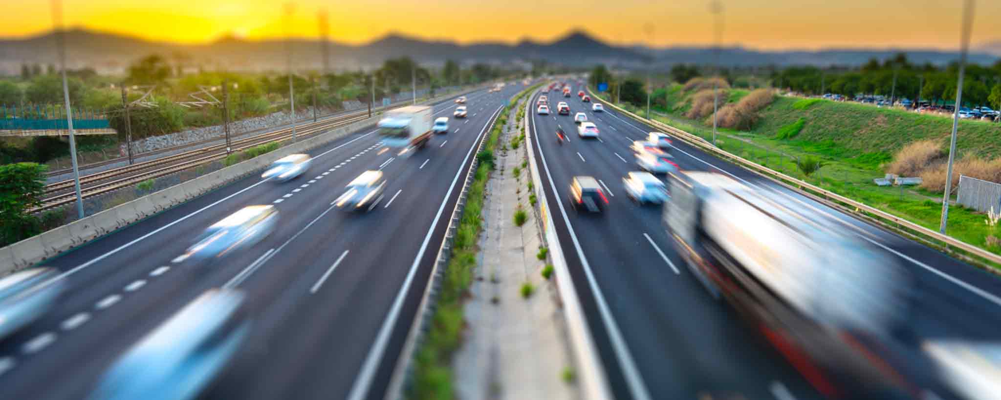 'Fast cars on highway.'