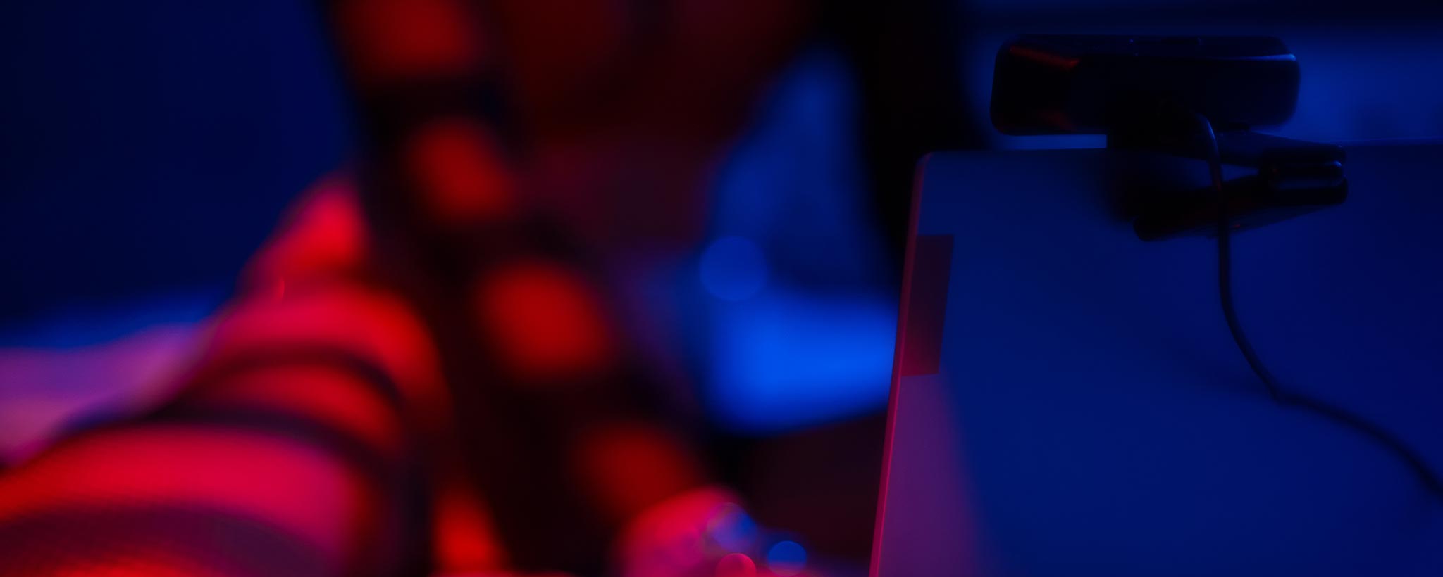 'A webcam model in the dark.'