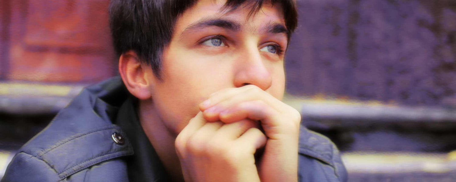Contemplative teenage boy