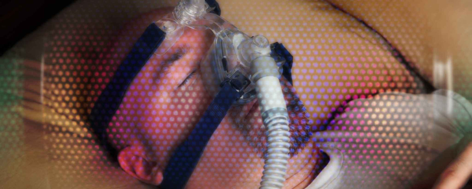 Sleeping man with CPAP
