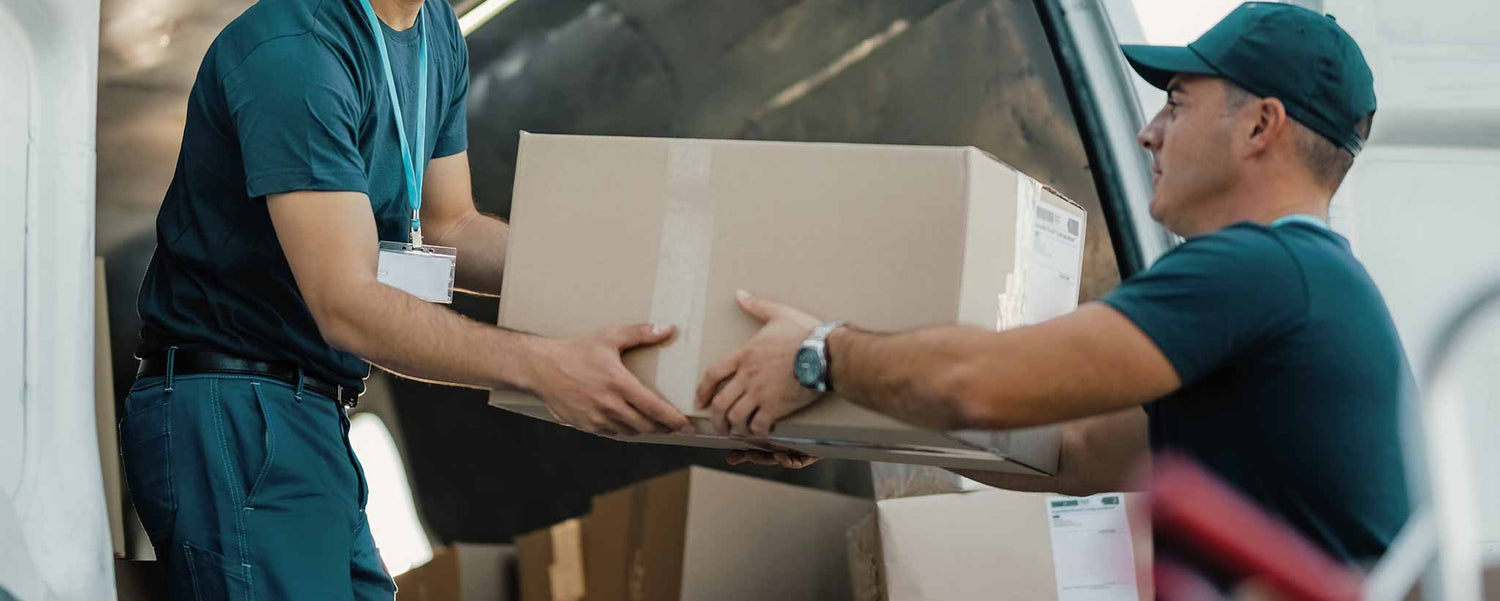 Men unloading boxes