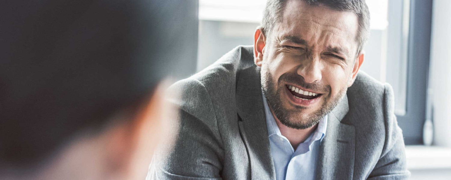 Bearded man uncomfortable listening