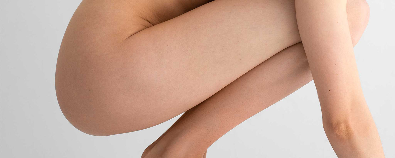 Profile of kneeling female buttocks