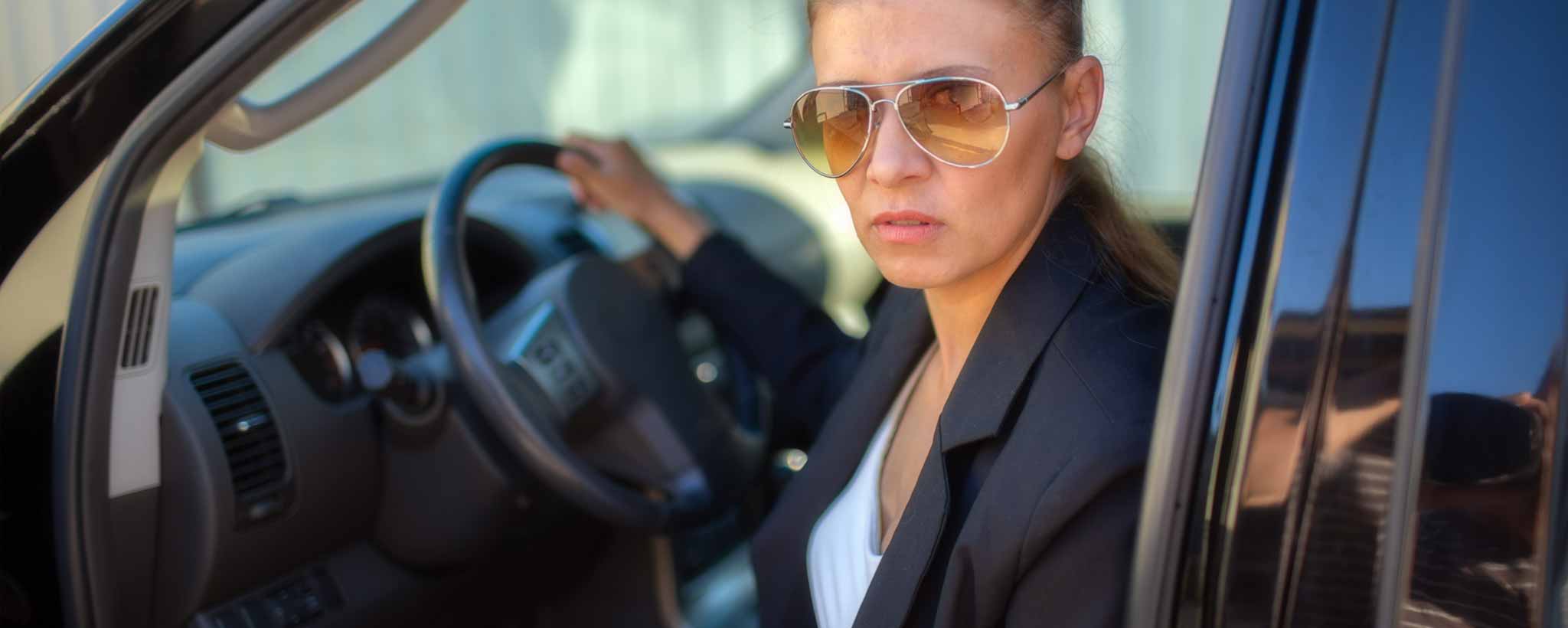 'A female patrol officer exiting vehicle.'