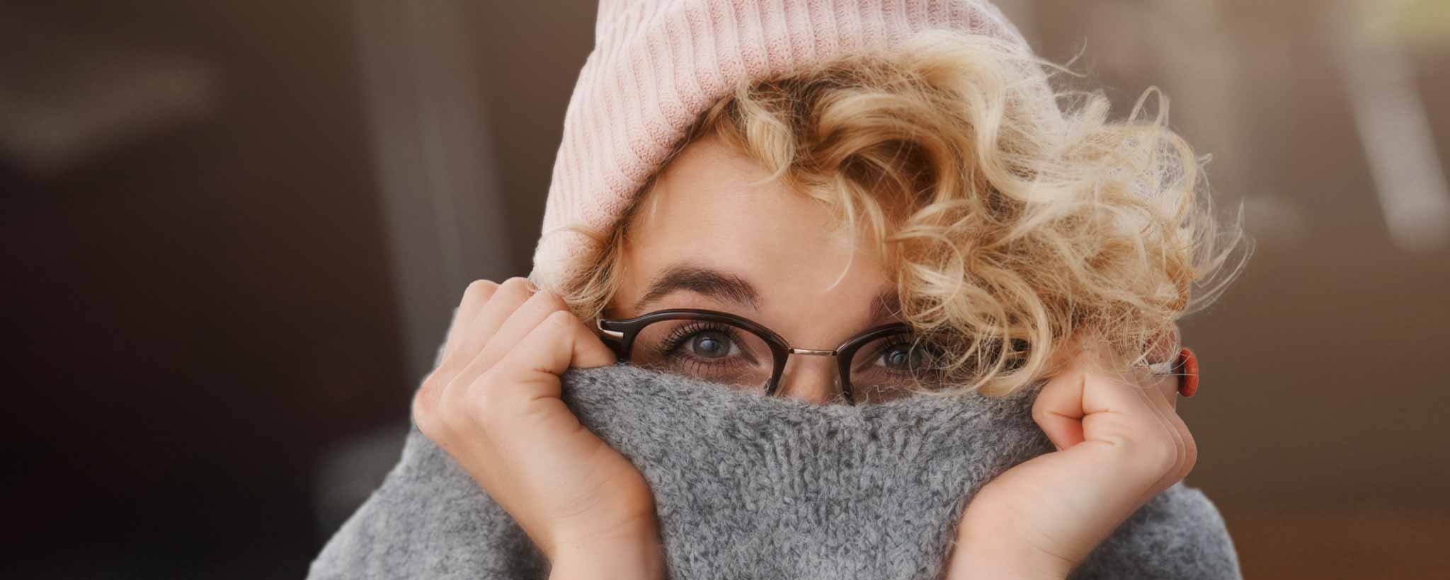 'Woman hiding behind sweater'