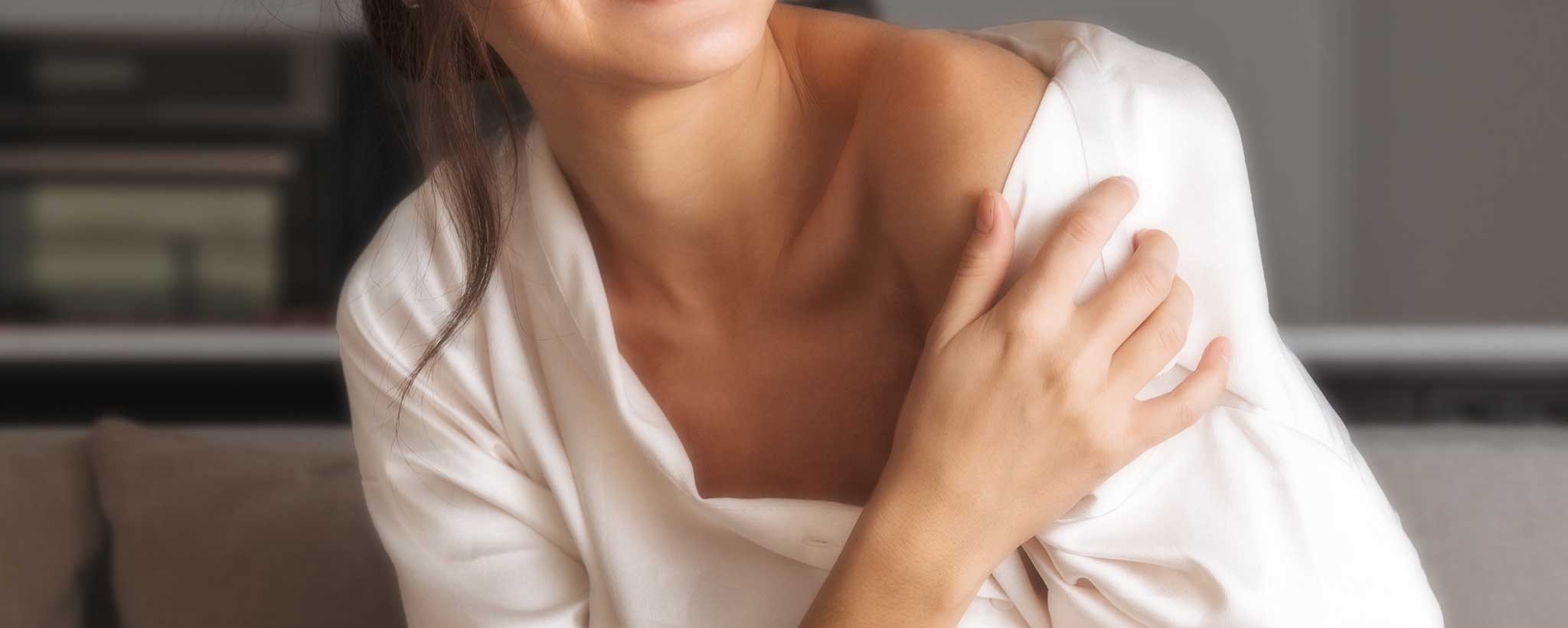 'A female exposes her shoulder.'