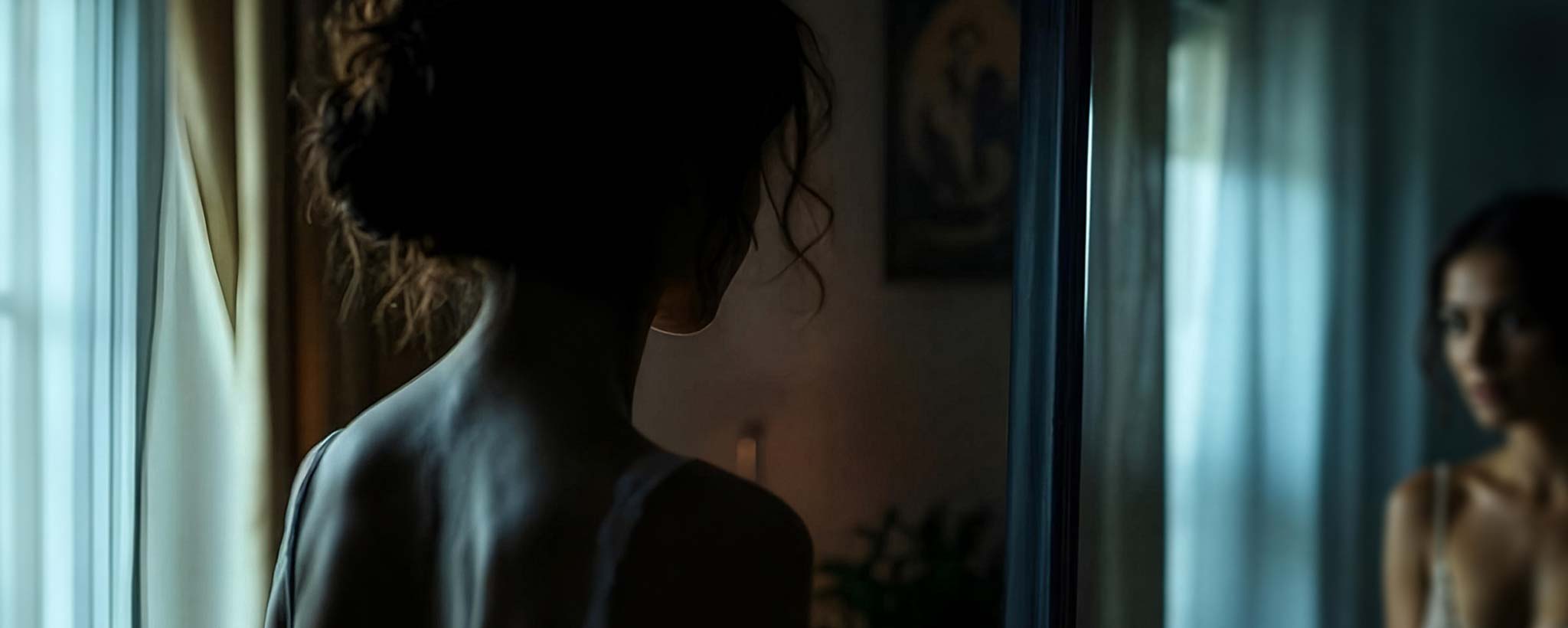 'Reyna gazes at her reflection, wondering if she could ever attract a man. (ai)'