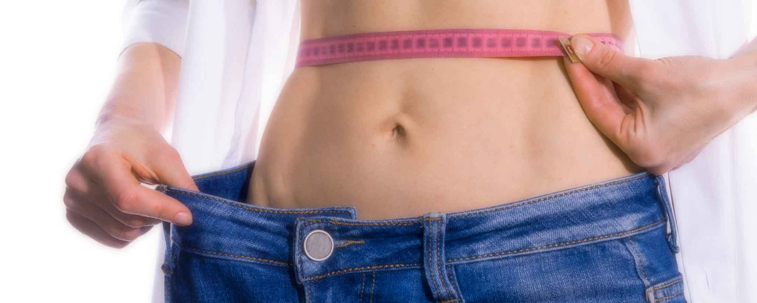 Woman measuring her waist