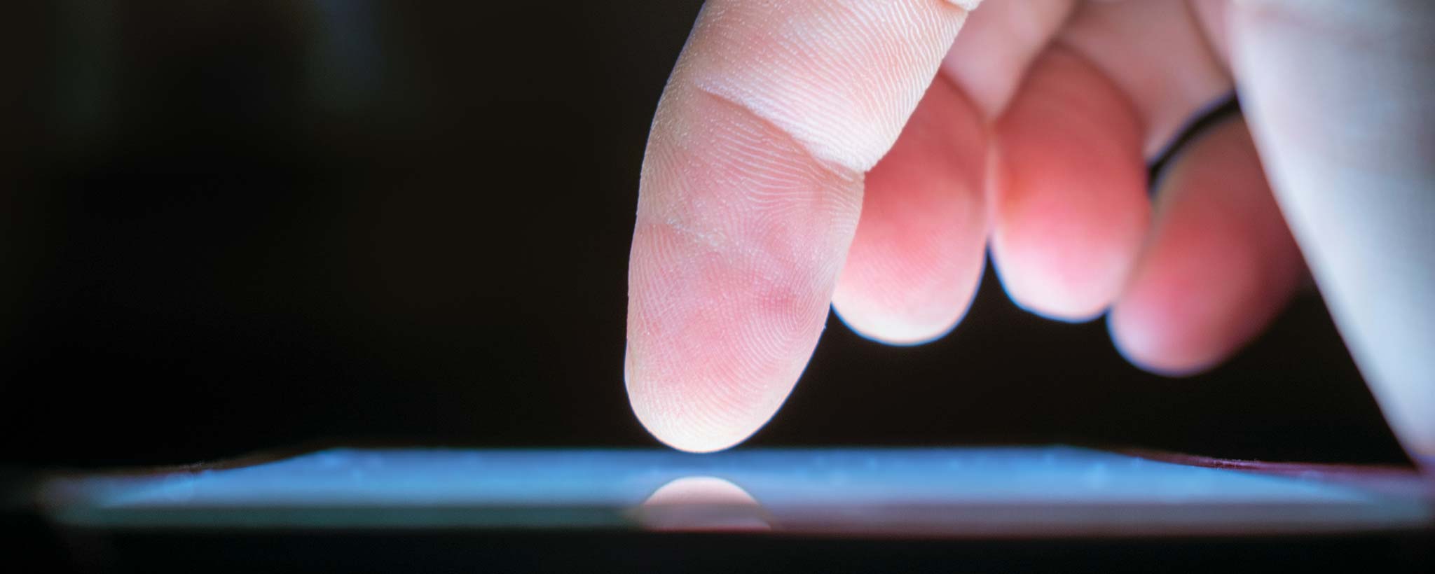 'Finger tapping digital screen'