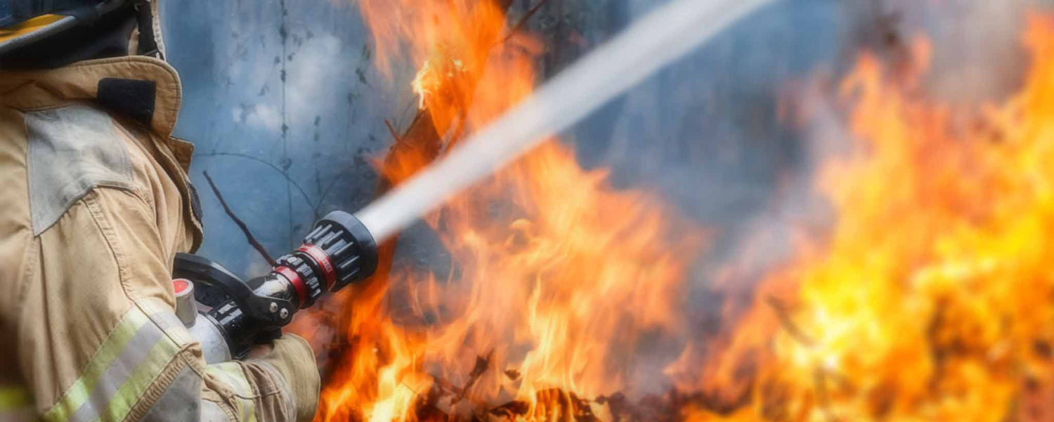 Firefighter with water hose