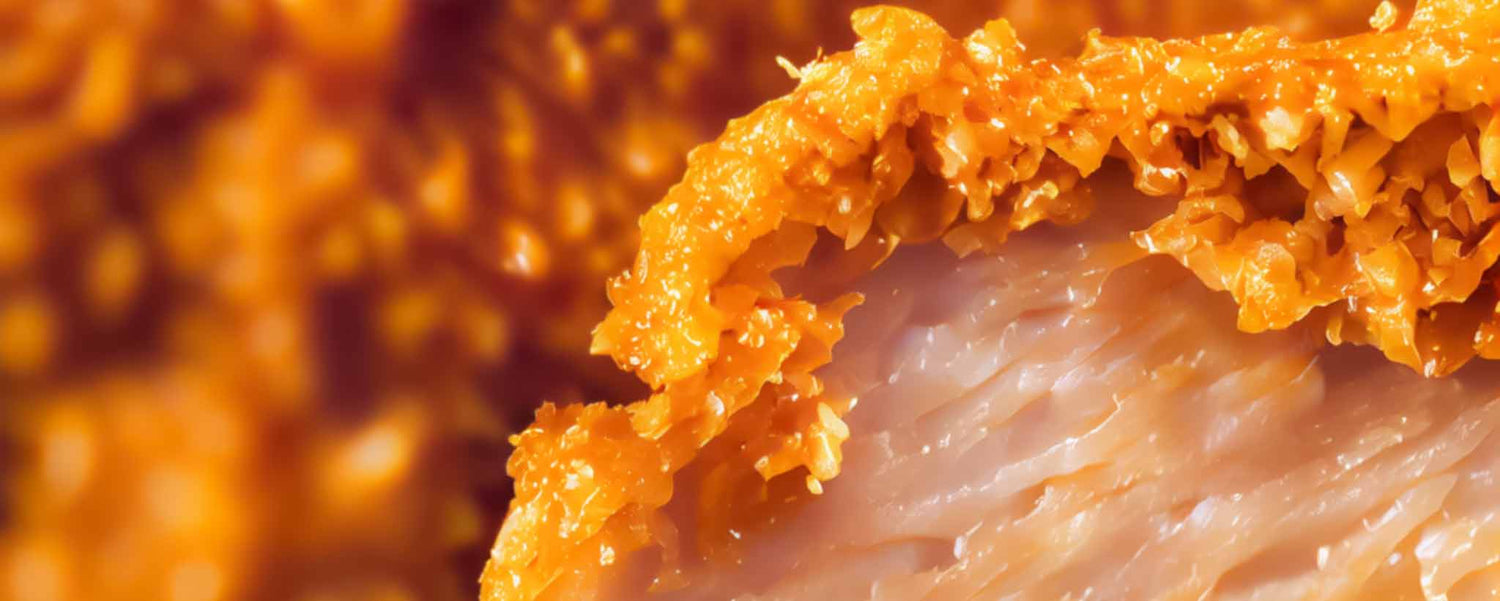 Close up of moist fried chicken.
