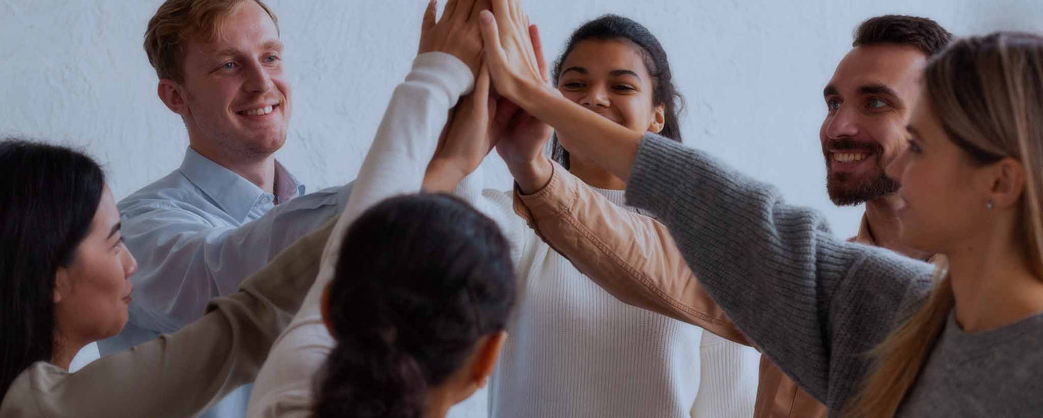 A group of neighbors raising their hands.