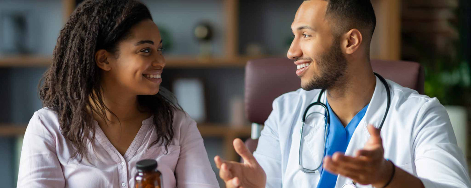 A doctor and a pharmaceutical rep are having a conversation in a medical setting.