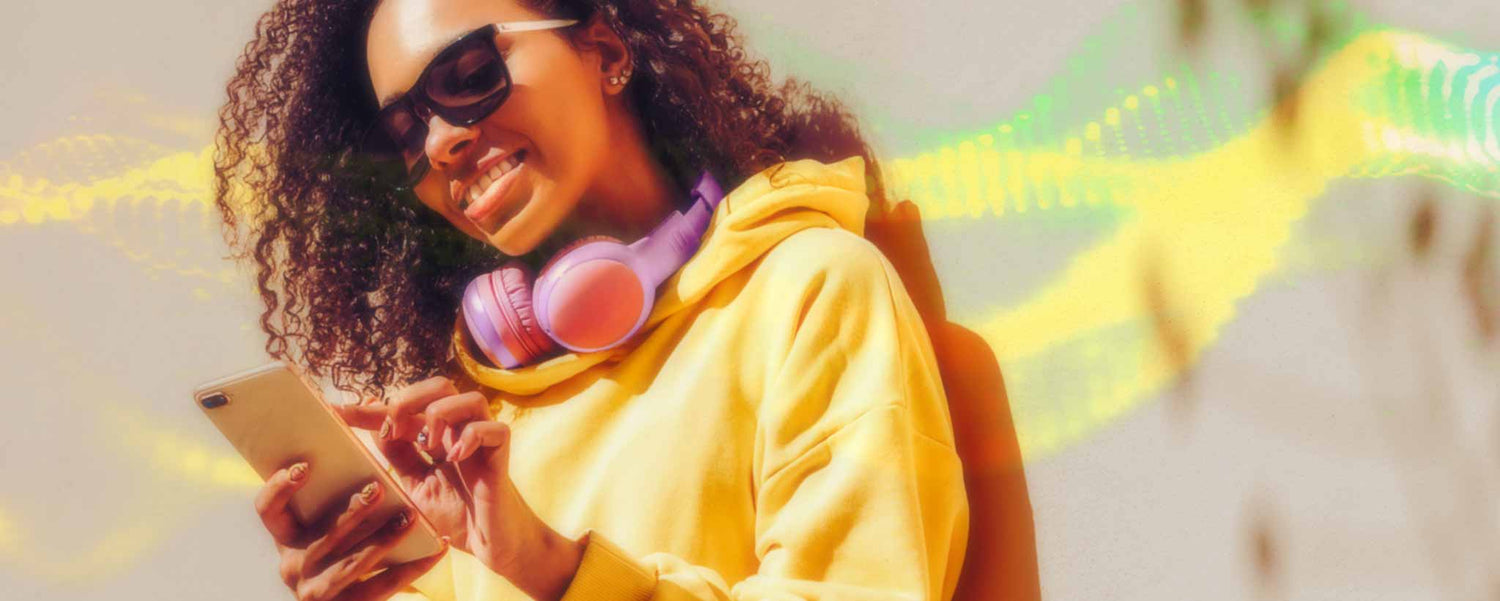 Young black woman with smartphone