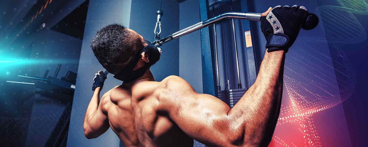 Masked male works out with pull-ups.