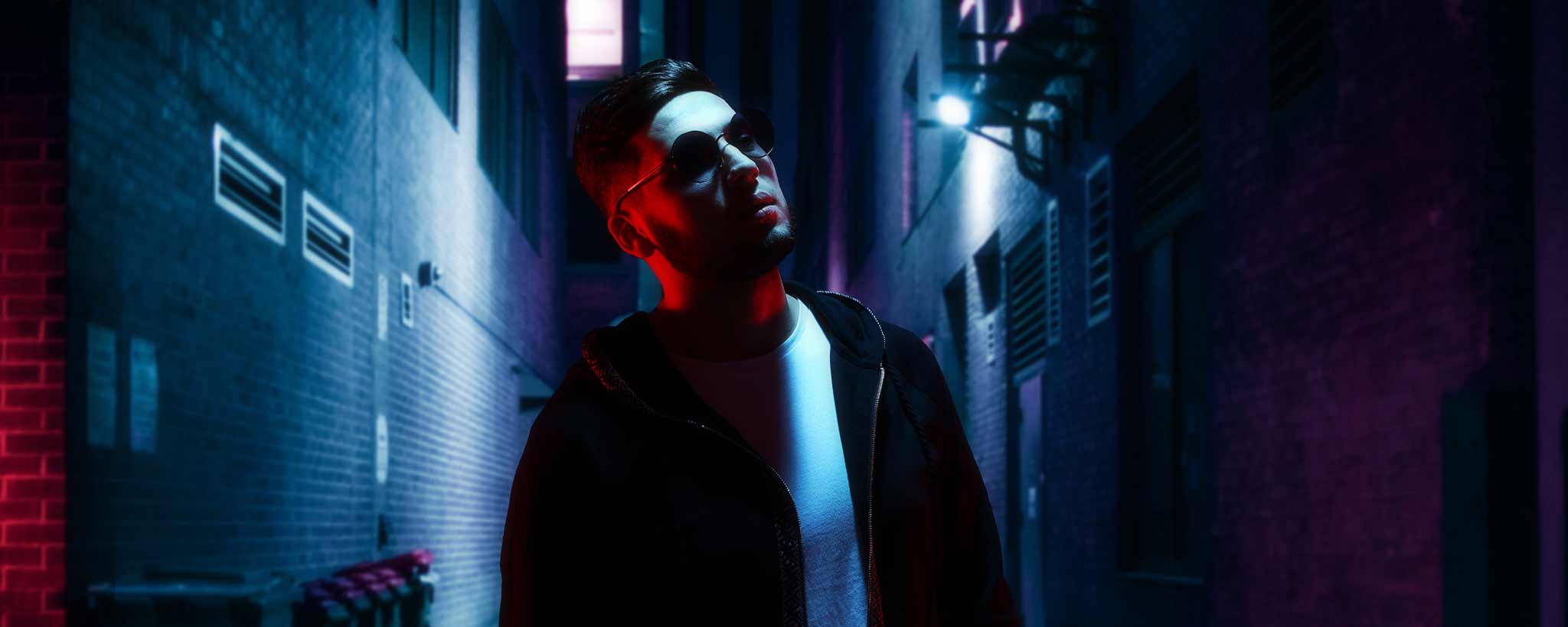 'Man walking in dark alley'