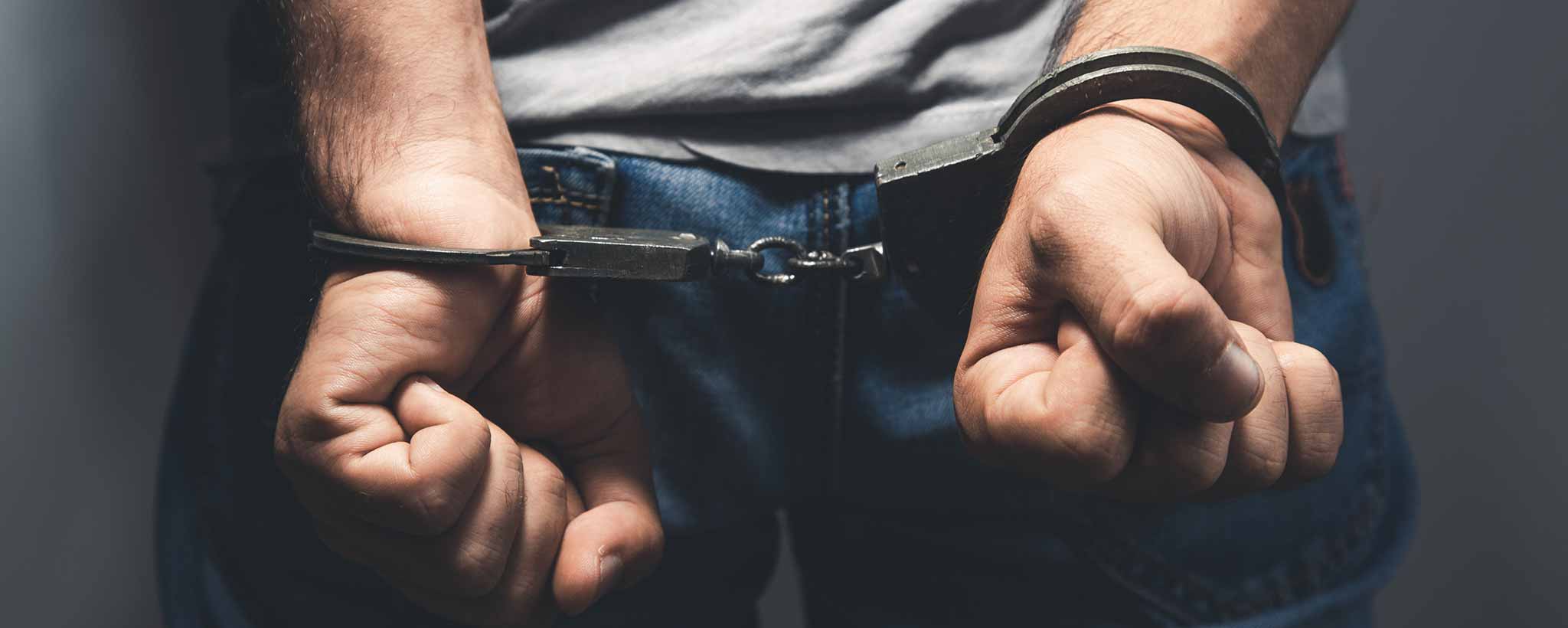 'Man handcuffs behind back'