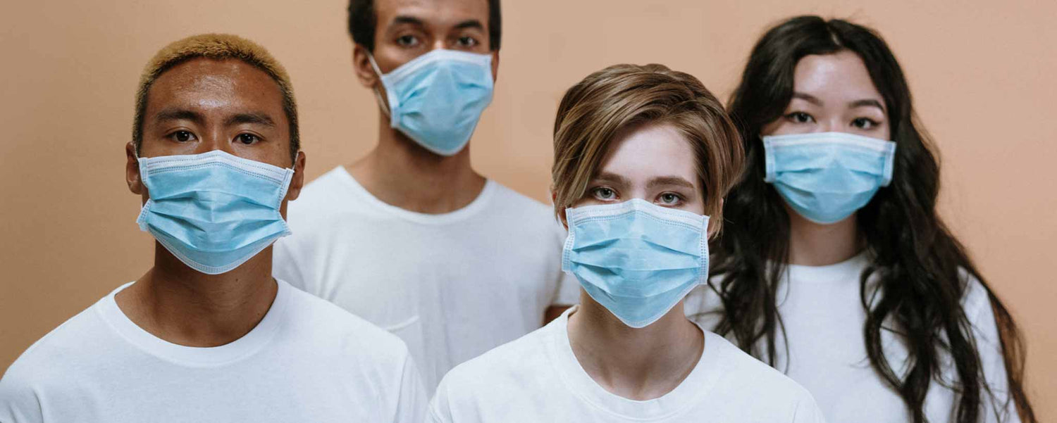 Masked group of four people