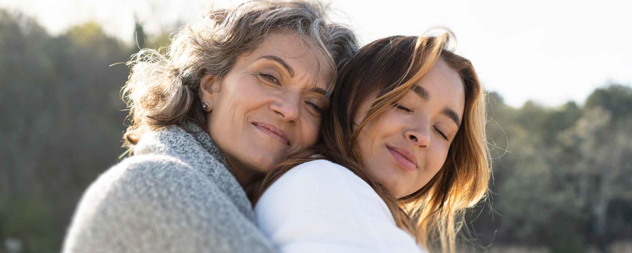 'Mature woman hugs teen'