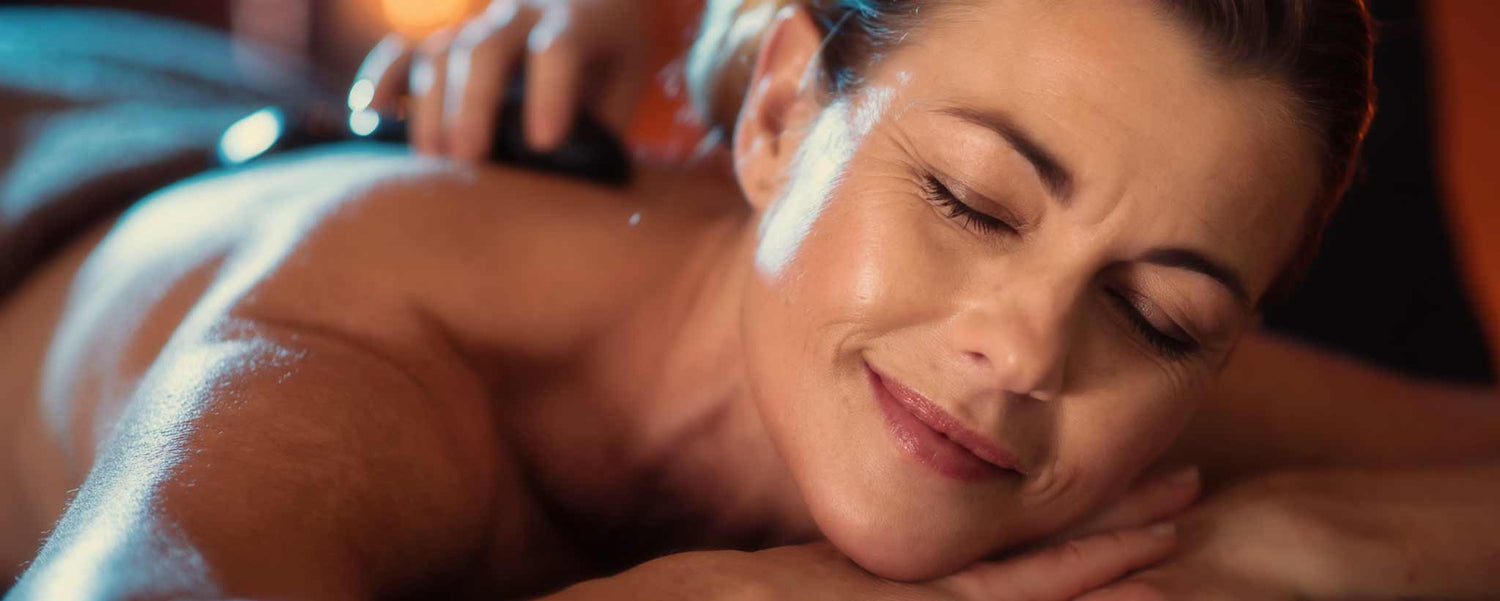 A female receives a back massage.