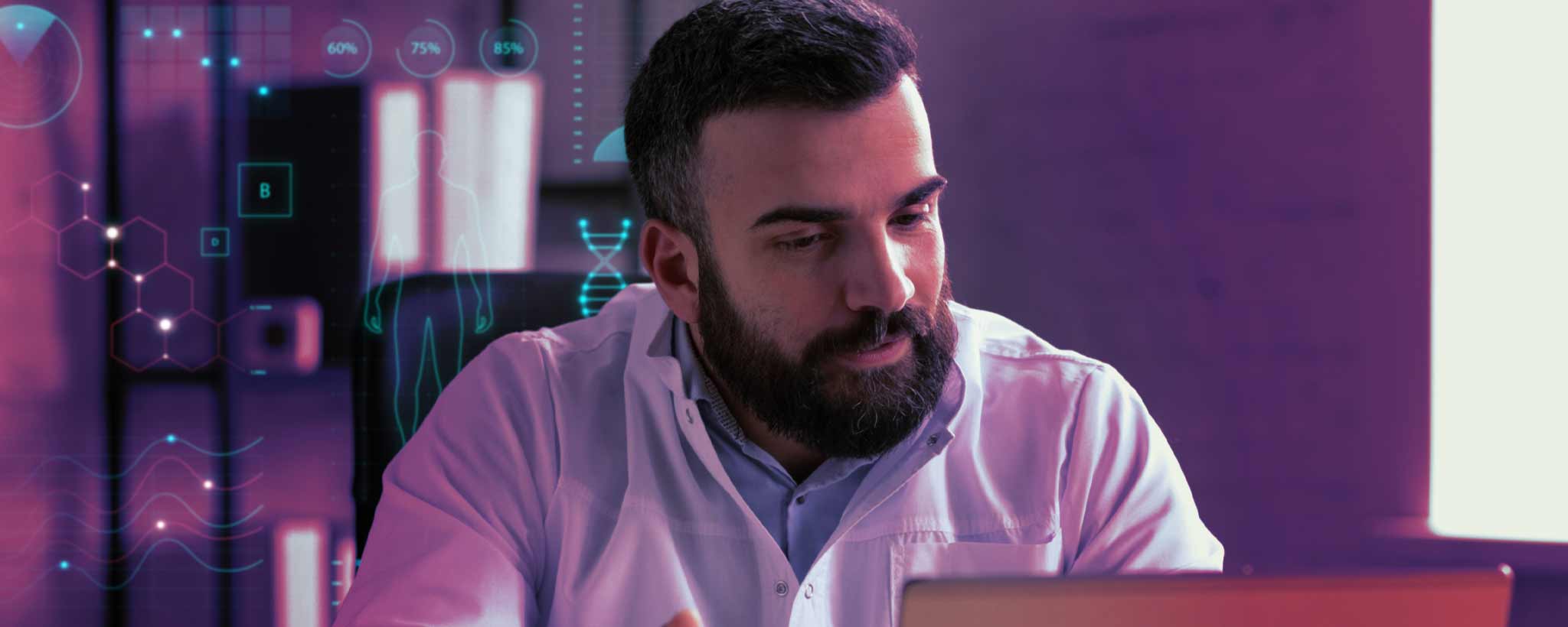 'A male doctor researching on his computer.'