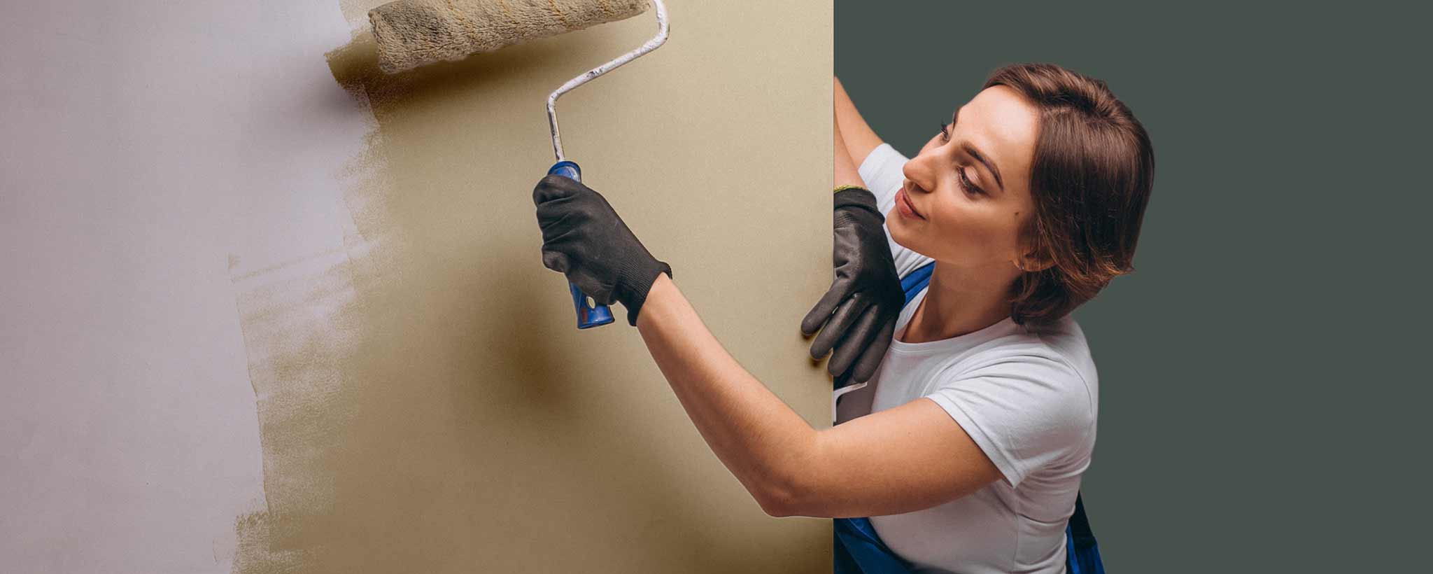 'Female roller painting wall'