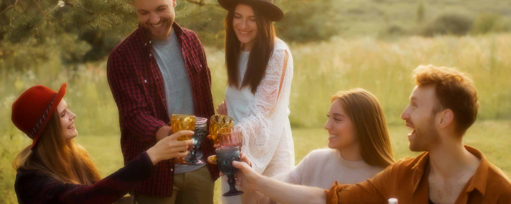 'A group of rural townspeople celebrate outdoors.'