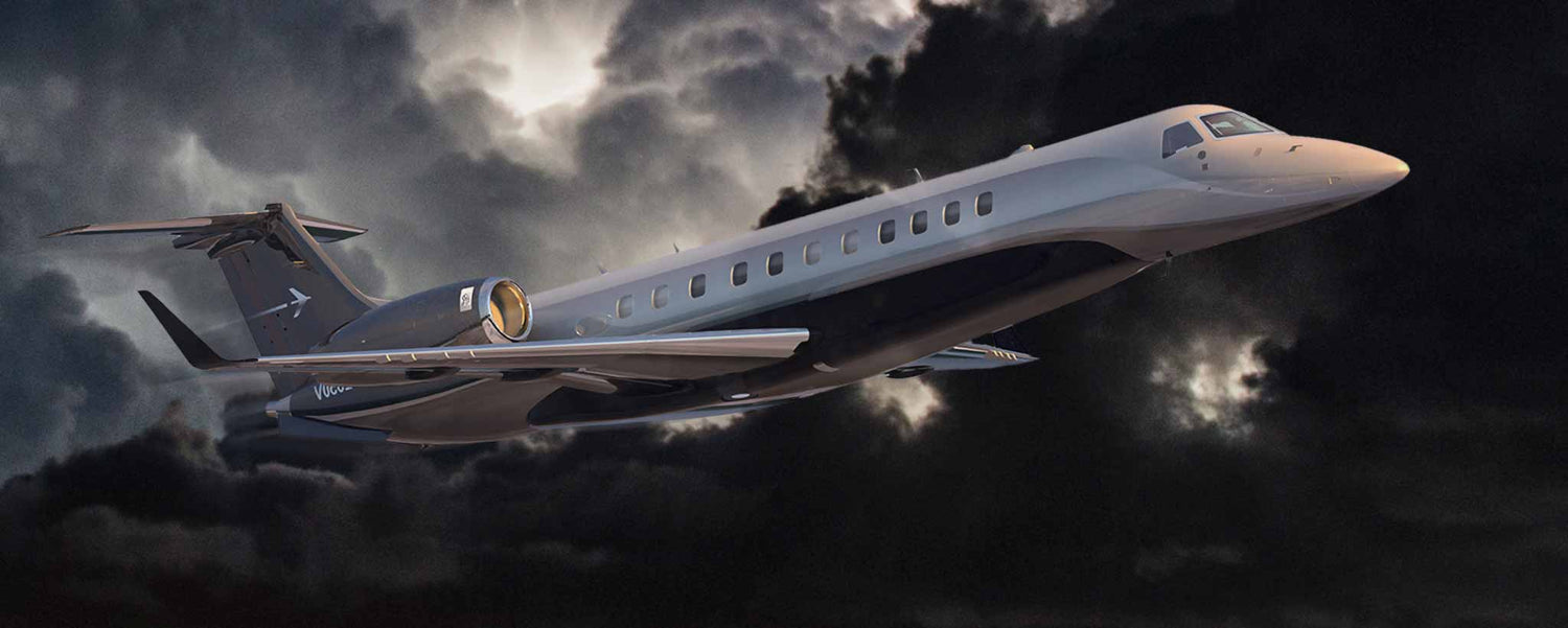 A Legacy 650e aircraft soars through nighttime storm clouds.