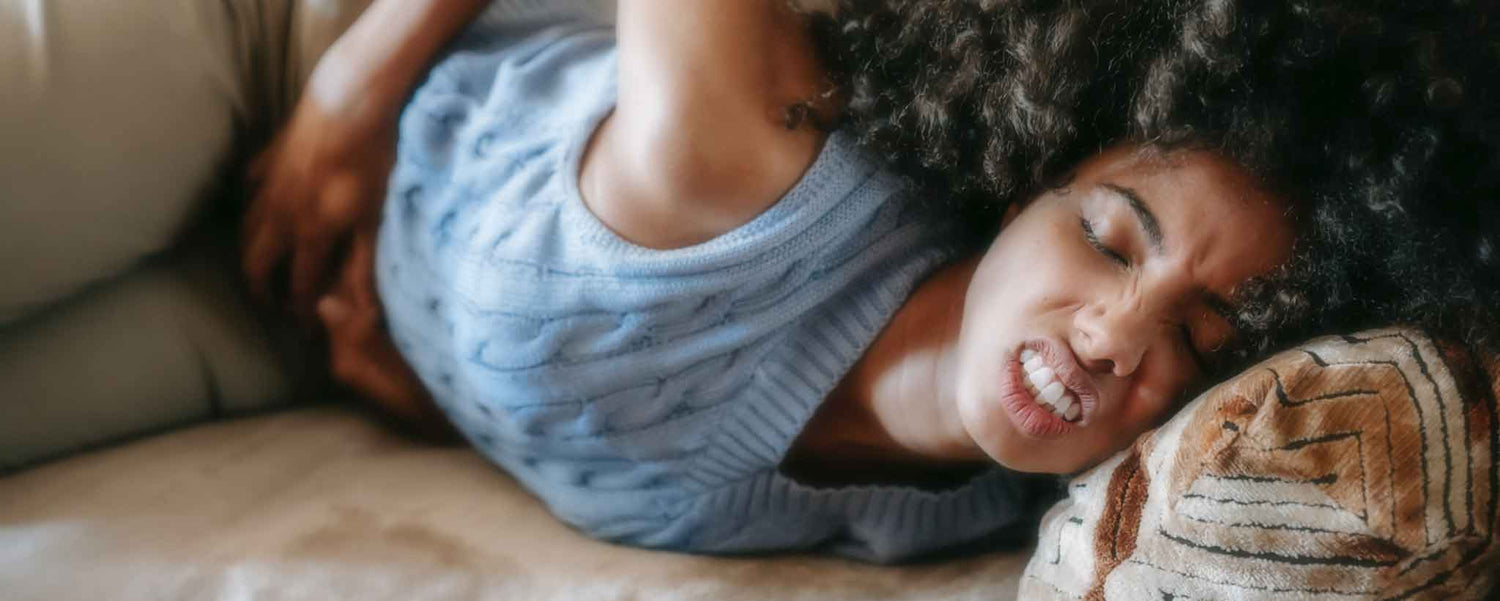 Bowel obstruction grimacing woman