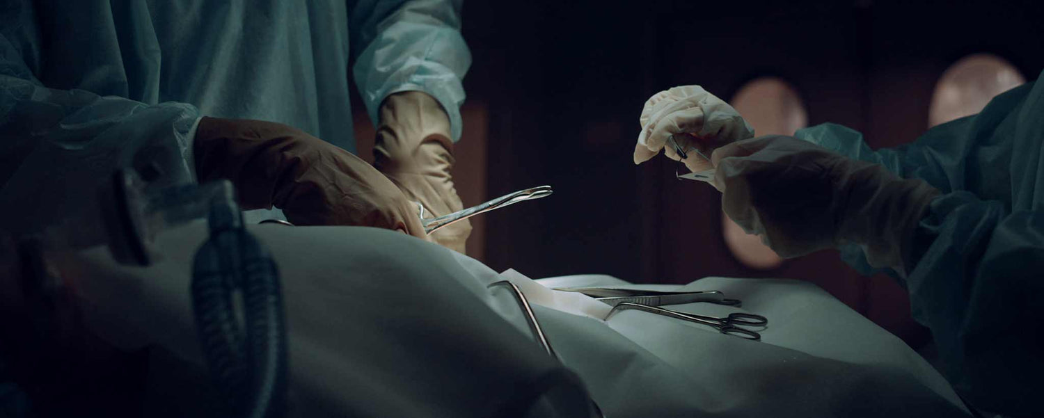 A surgery in a dark hospital room.