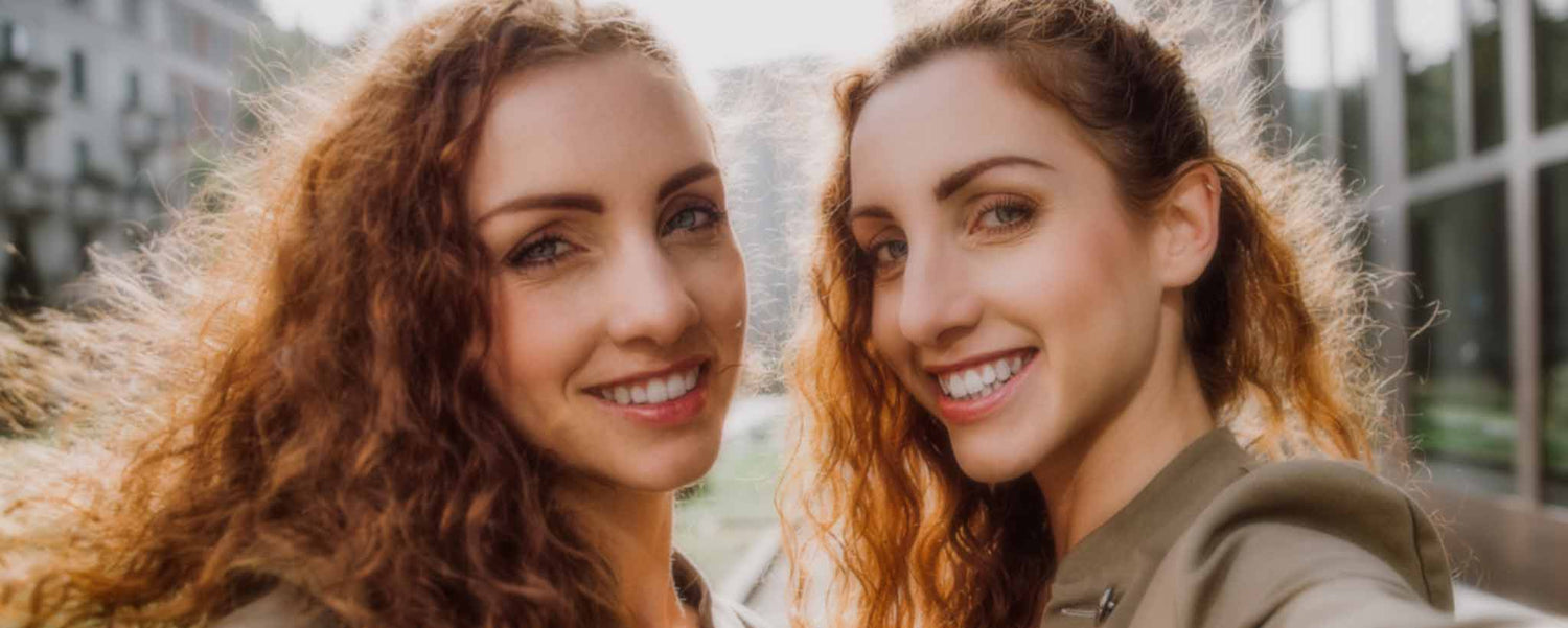 Smiling redhead twins