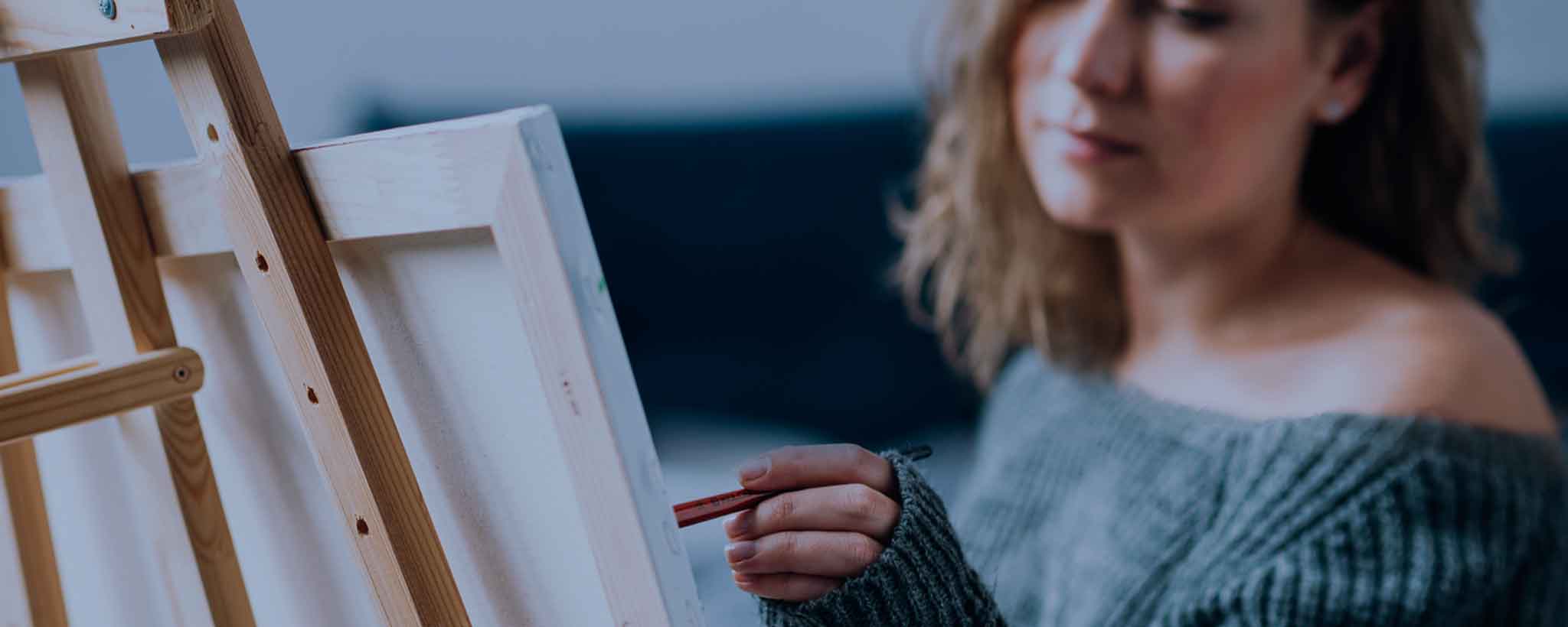 'Woman painting on canvas'