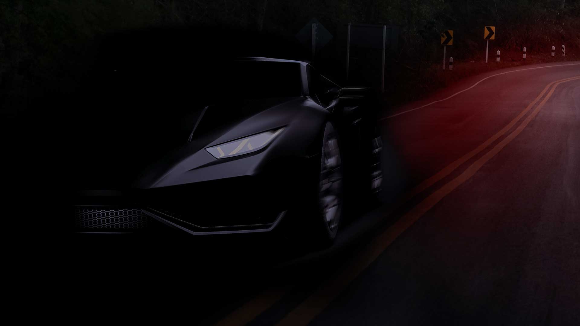Black sports car driving on nighttime road