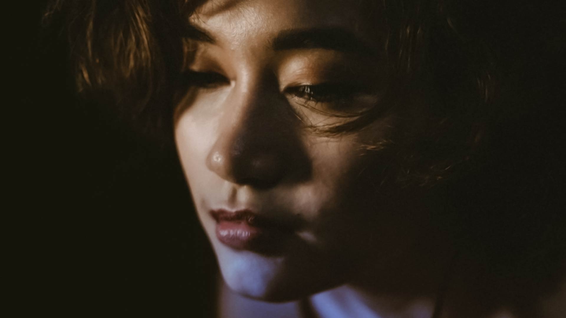 A sad Asian female portrait.