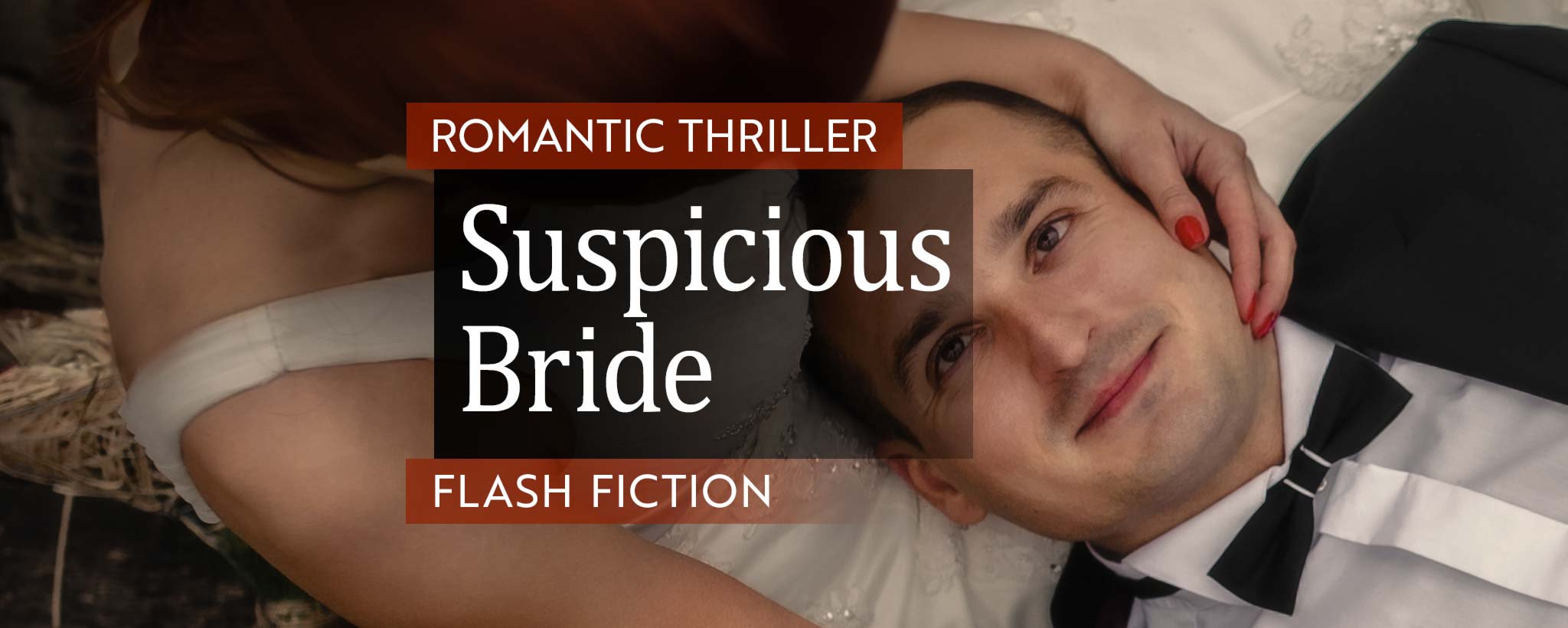 'A redhead bride holds her groom's head, as he lies on her lap.'