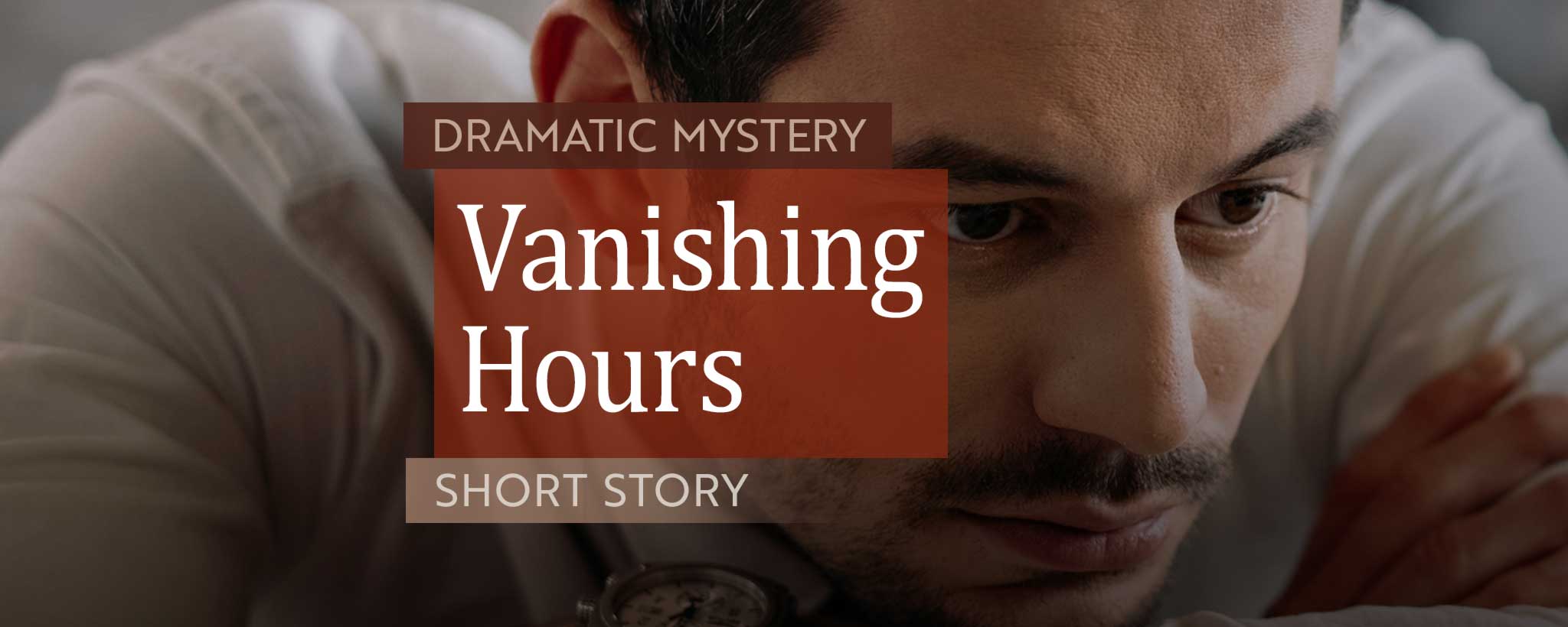 'Man at his office desk rests his head on his arms.'