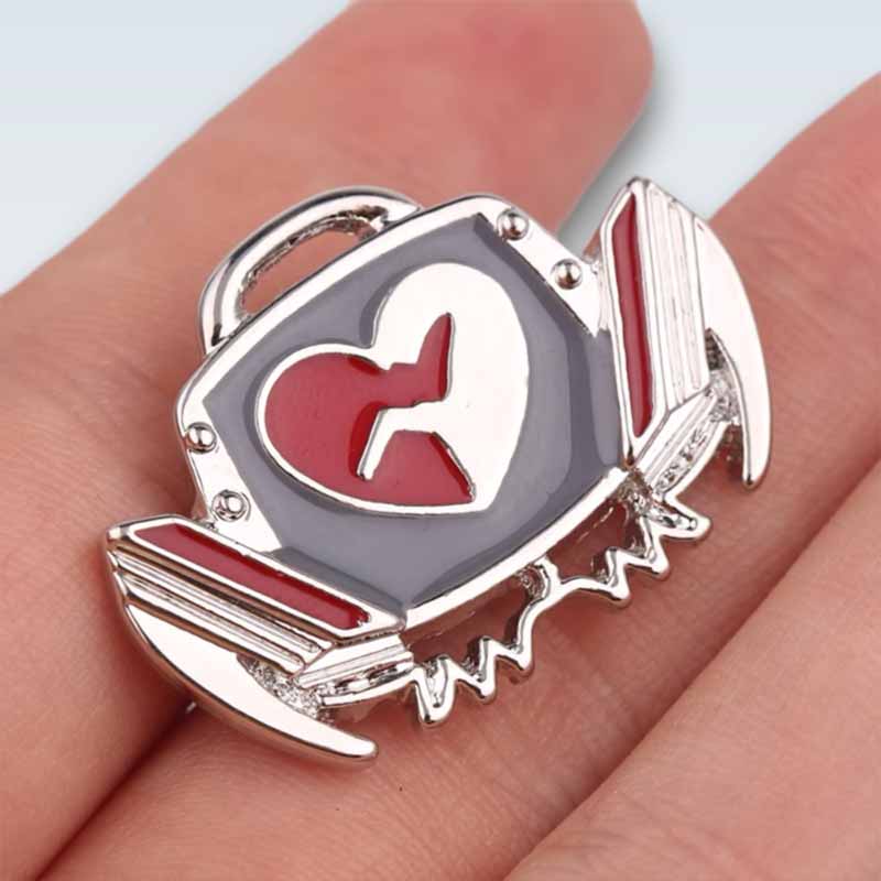 Holding Defibrillator Lapel Pin