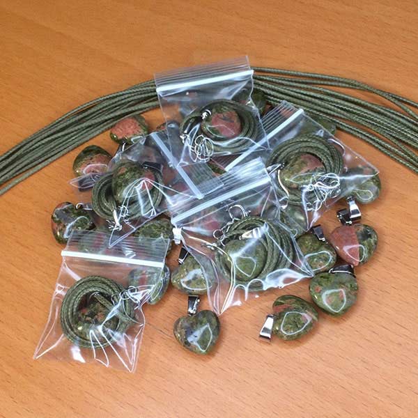 Green Stone Heart Necklaces on Desk