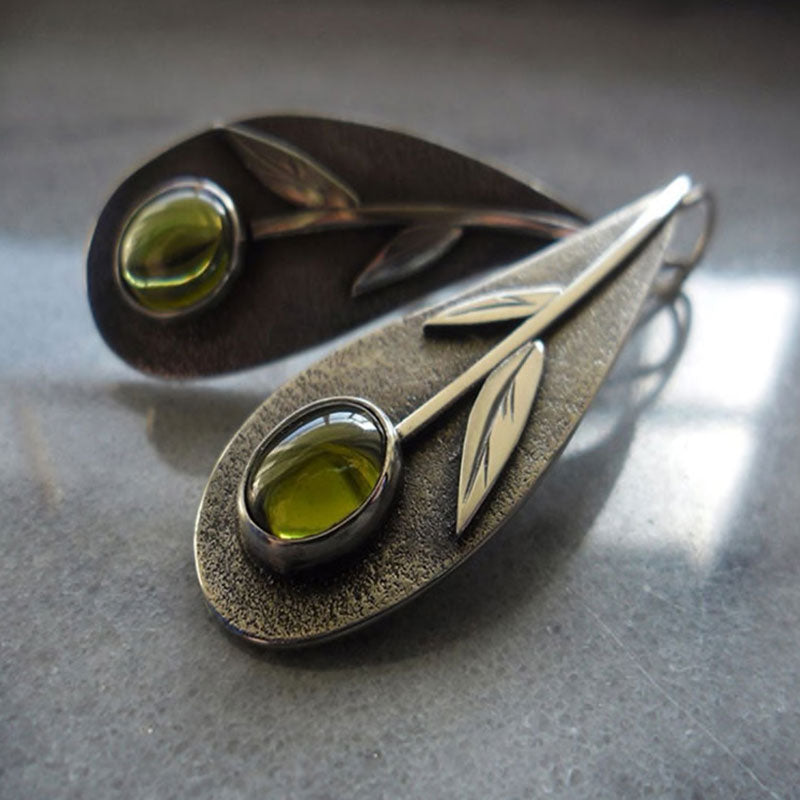 Plant Leaf Olive Green Stone Earrings on Table