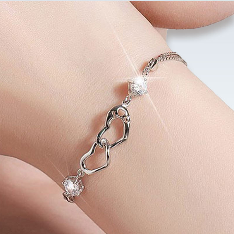 Wearing Sterling Silver Heart Charm Bracelet
