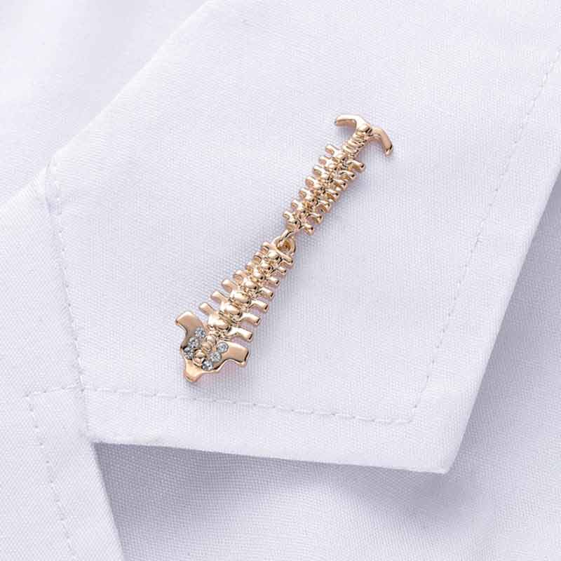 Wearing Gold Spine Lapel Pin