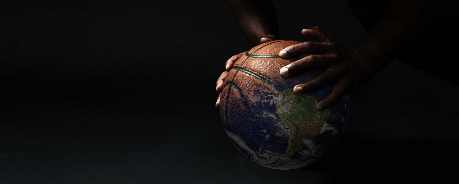 Hands holding basketball