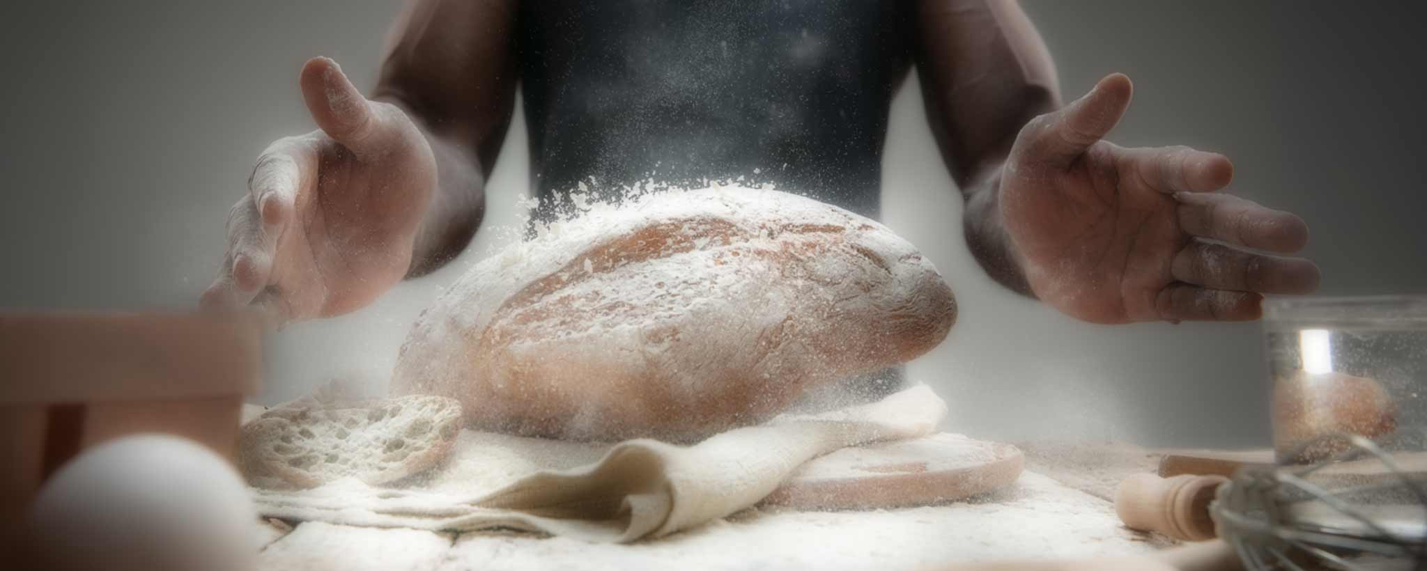 'Black baker tosses bread'